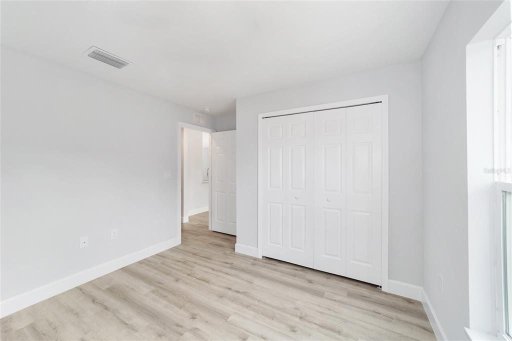 14395 Southwest 18th Place Ocala, FL 34481 - Photo 29 of 38 a view of an empty room with wooden floor