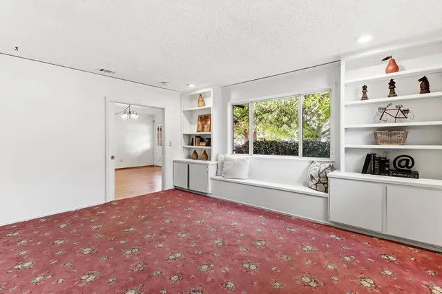 a large white bed in a white room