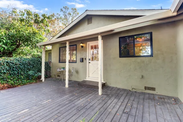 an entrance view of a house with wooden floor