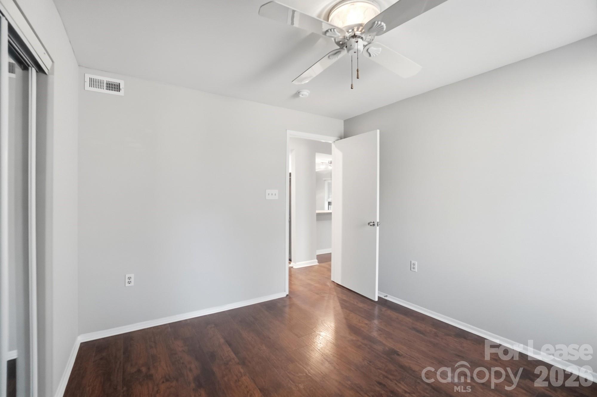 4948 Sardis Road, Unit C Charlotte, NC 28270 - Photo 17 of 25 wooden floor in an empty room
