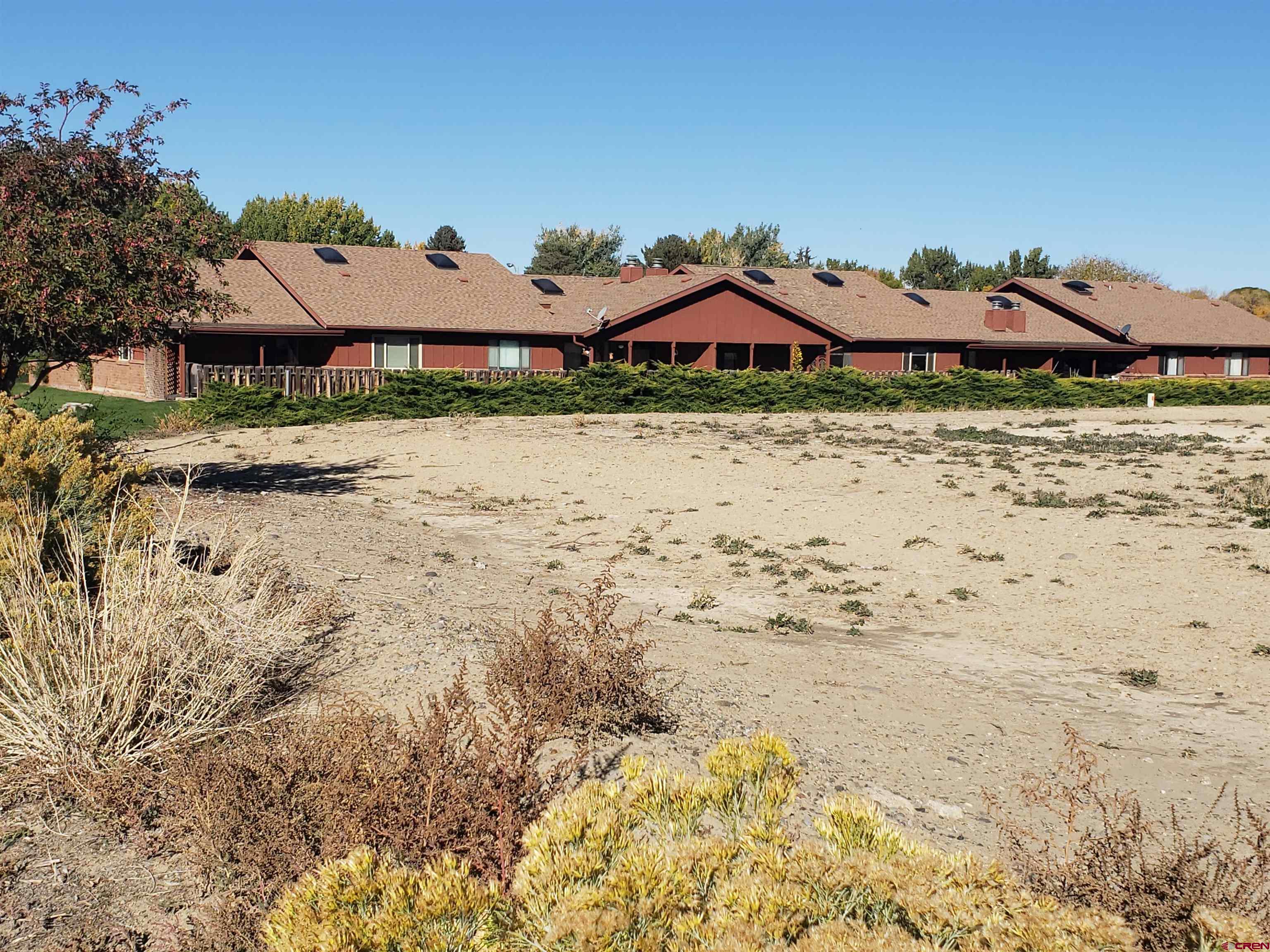 Tbd Margo Court Montrose, CO 81401 - Photo 6 of 12 a front view of a house with a yard