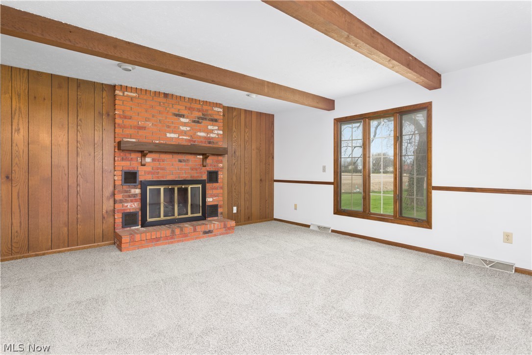 8514 West Ridge Road Elyria, OH 44035 - Photo 8 of 33 Family room with fireplace and large windows to the backyard