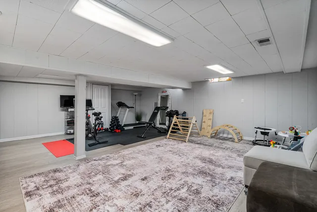 a view of a room with furniture and white walls