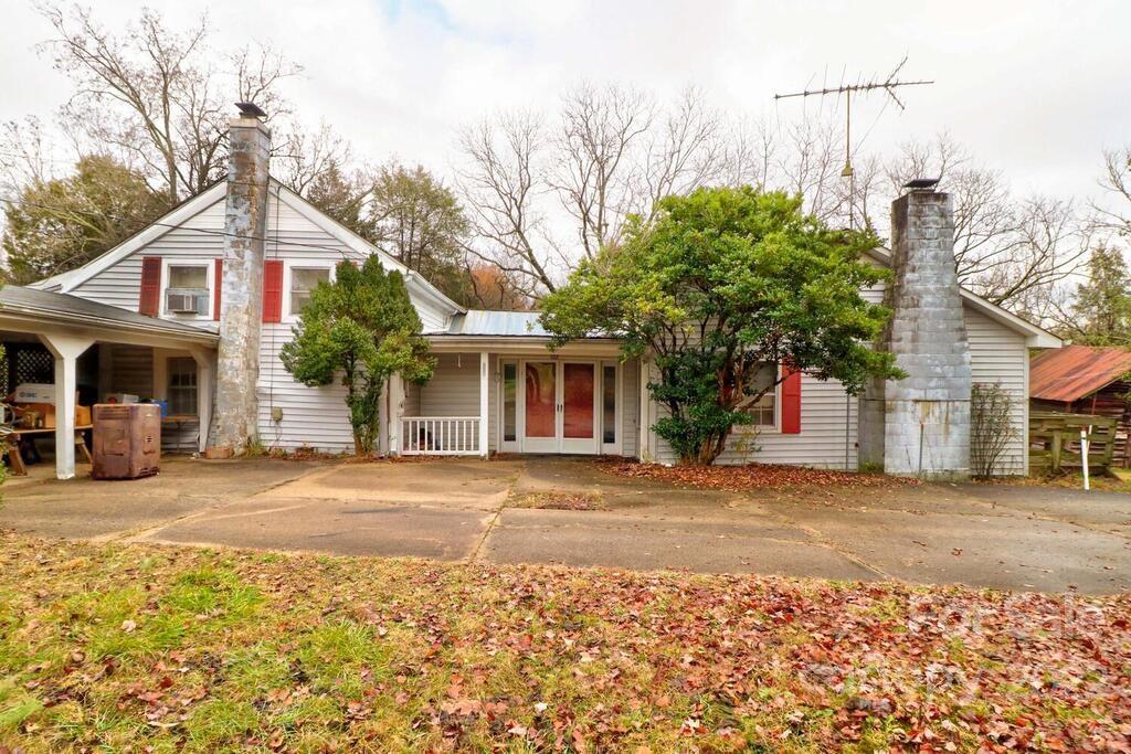 555 Bradshaw Road Salisbury, NC 28147 - Photo 1 of 48 a front view of a house with a garden and trees