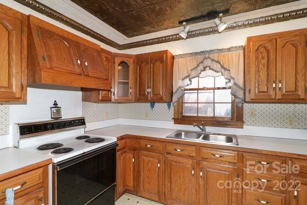 555 Bradshaw Road Salisbury, NC 28147 - Photo 12 of 48 a kitchen with stainless steel appliances granite countertop a sink a stove and a refrigerator