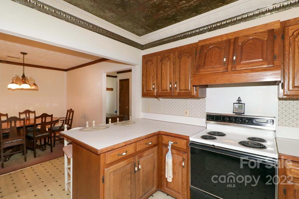 555 Bradshaw Road Salisbury, NC 28147 - Photo 14 of 48 a kitchen with stainless steel appliances granite countertop a sink stove and cabinets