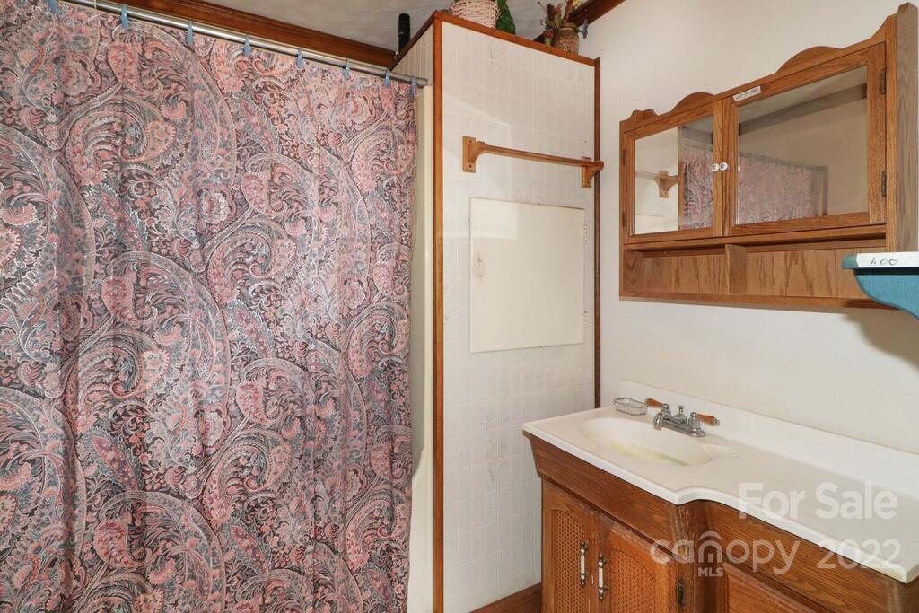 555 Bradshaw Road Salisbury, NC 28147 - Photo 16 of 48 a bathroom with a sink and a mirror