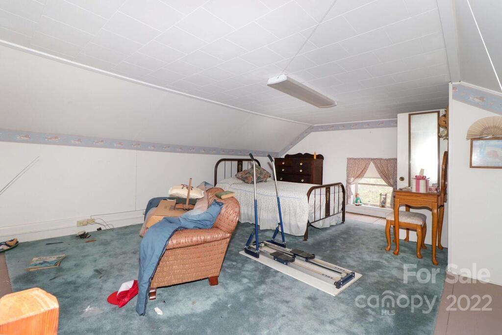 555 Bradshaw Road Salisbury, NC 28147 - Photo 29 of 48 a room with gym equipment and wooden floor