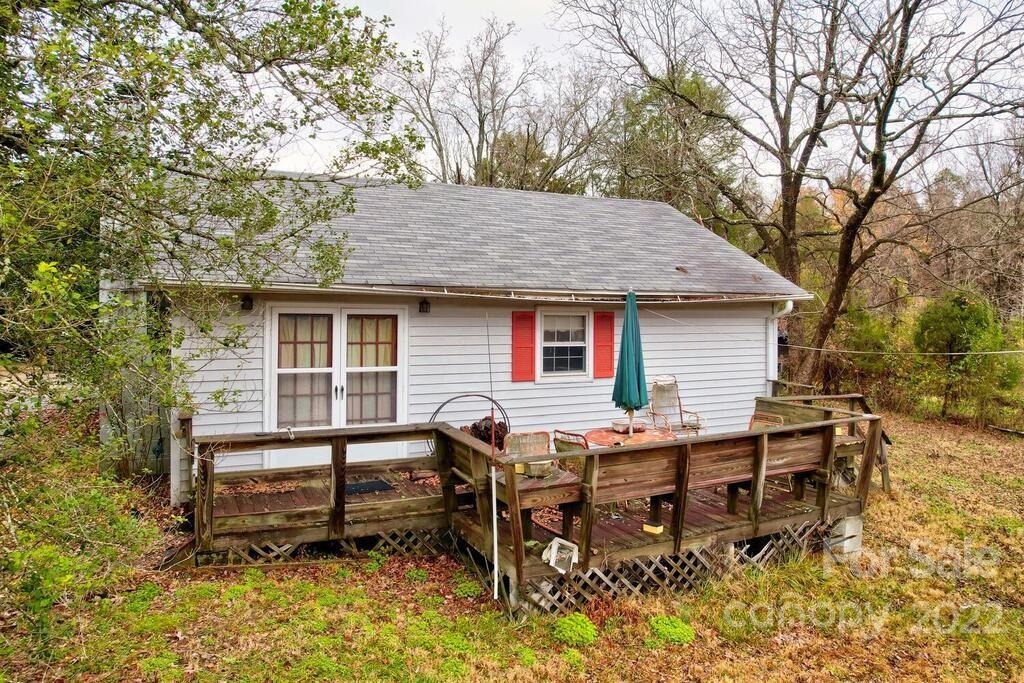 555 Bradshaw Road Salisbury, NC 28147 - Photo 31 of 48 a view of a house with a chairs and table in the patio