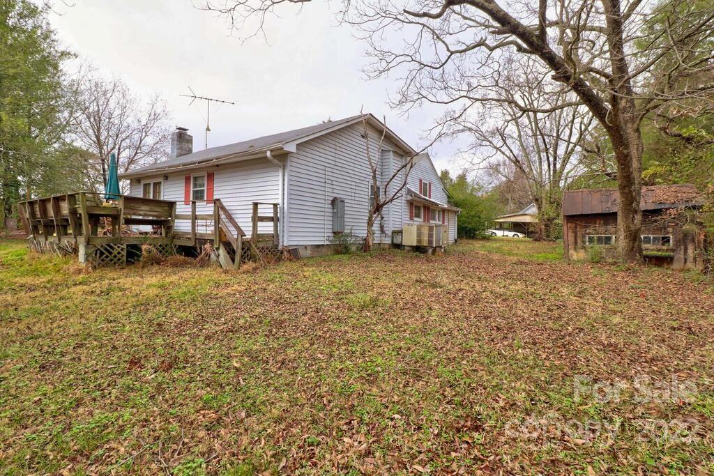 555 Bradshaw Road Salisbury, NC 28147 - Photo 32 of 48 a view of a backyard with a large tree