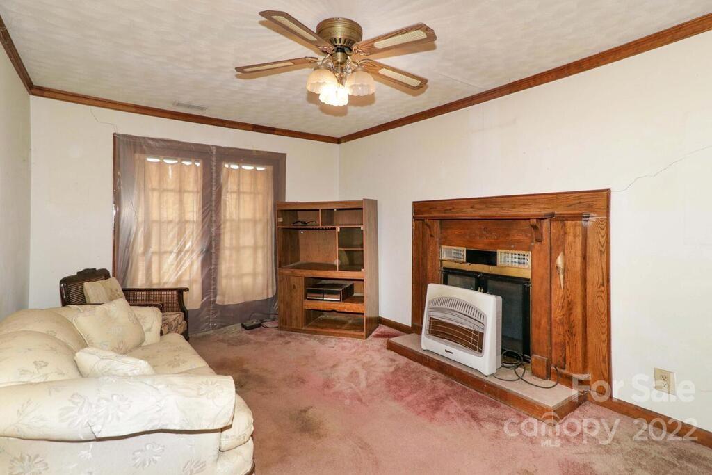 555 Bradshaw Road Salisbury, NC 28147 - Photo 6 of 48 a living room with furniture and a fireplace