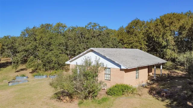 a house with trees in front of it