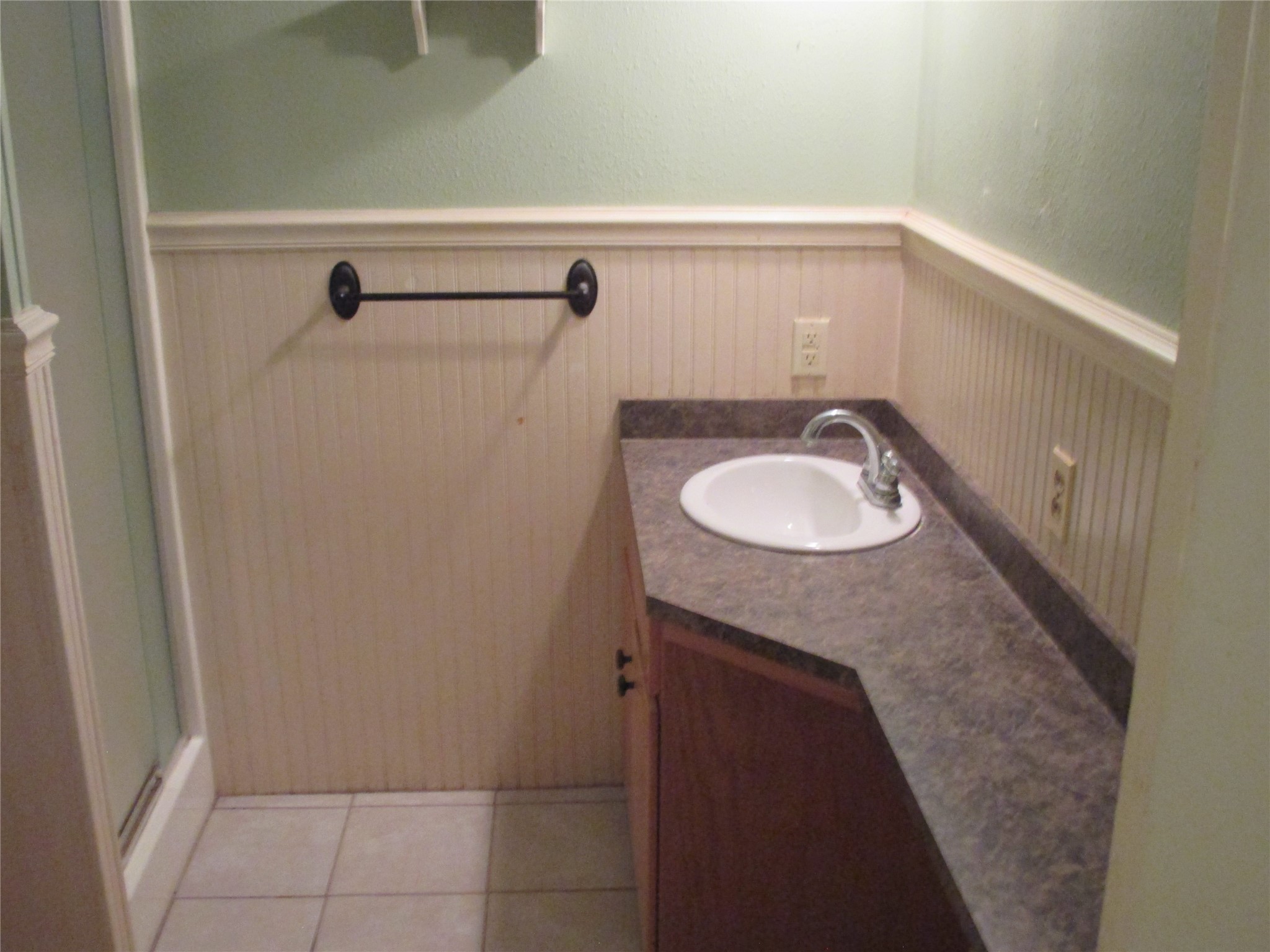 12610 Pecan School Road Bartlett, TX 76511 - Photo 17 of 21 A well-appointed bathroom features a practical single vanity and easy-care tile flooring.