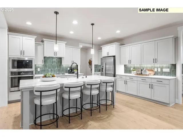 a kitchen with kitchen island granite countertop a table and chairs