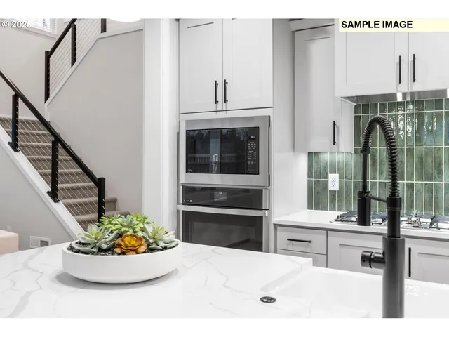 a kitchen with a sink and a stove