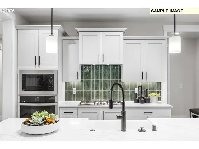 a kitchen with a table and chairs