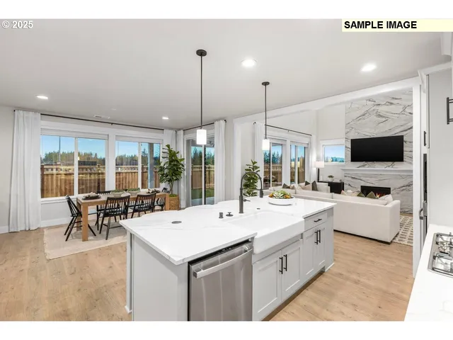 a large white kitchen with a large window