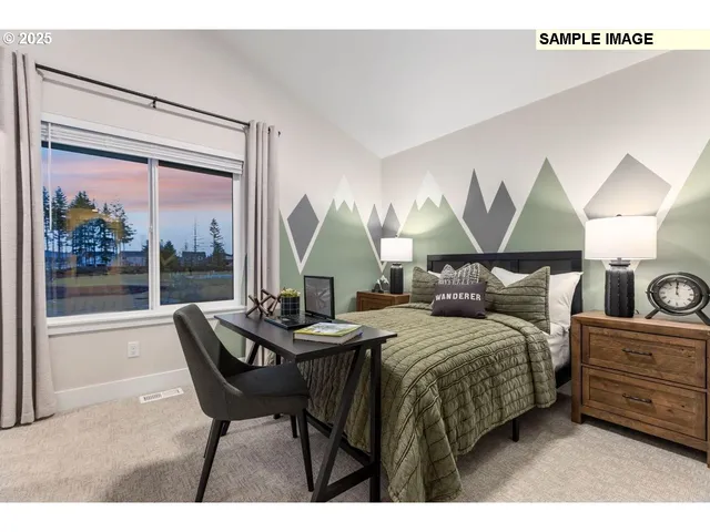 a bedroom with a bed and large windows