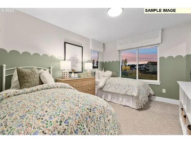 a living room with a bed furniture and a large window