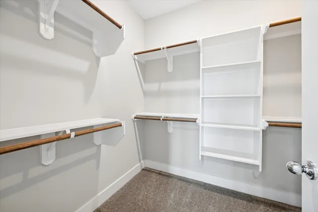 a view of an empty walk in closet