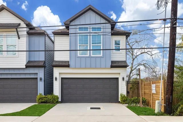 a front view of a house with yard