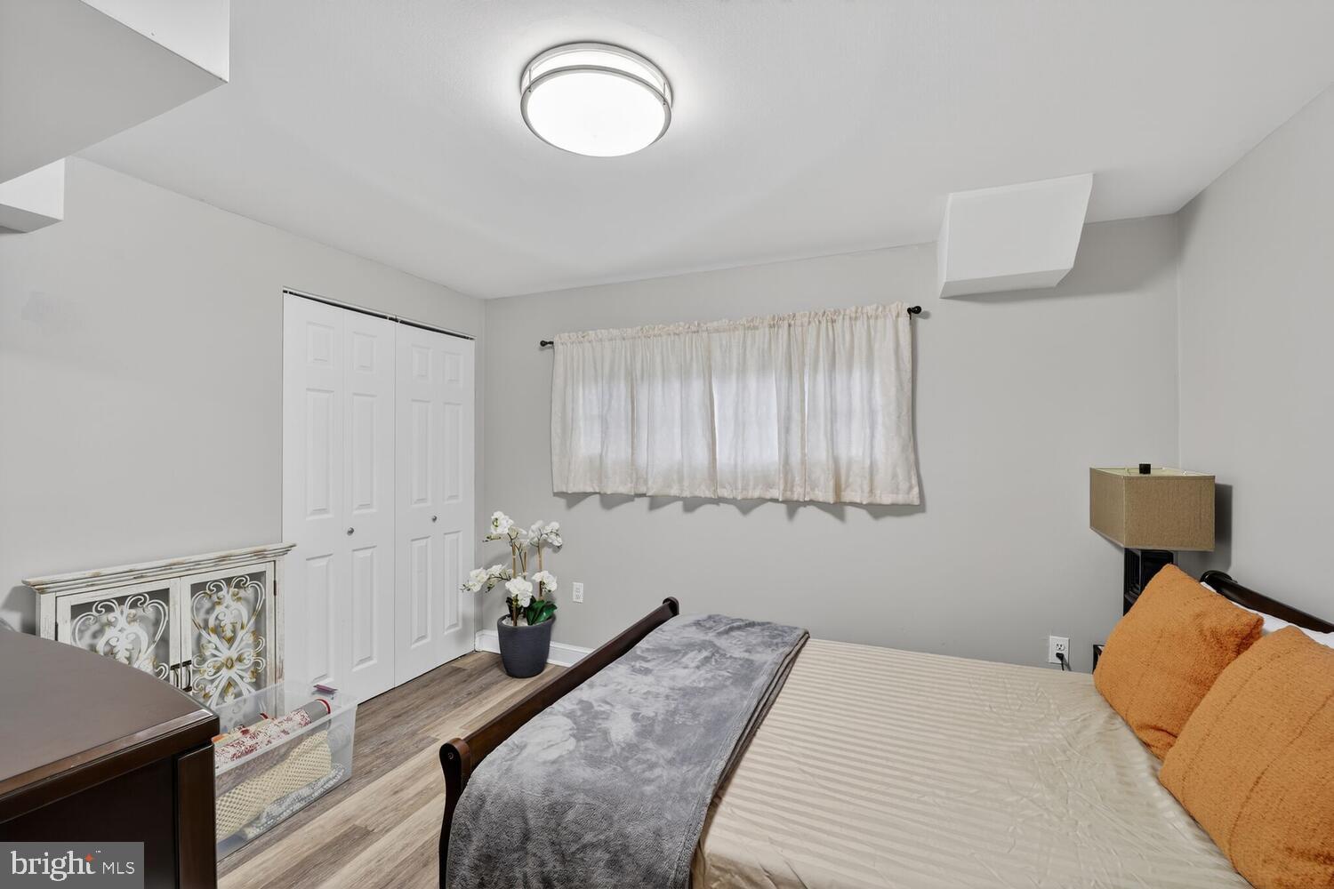 1432 35th Street Southeast Washington, DC 20020 - Photo 24 of 36 a bedroom with a bed and a window