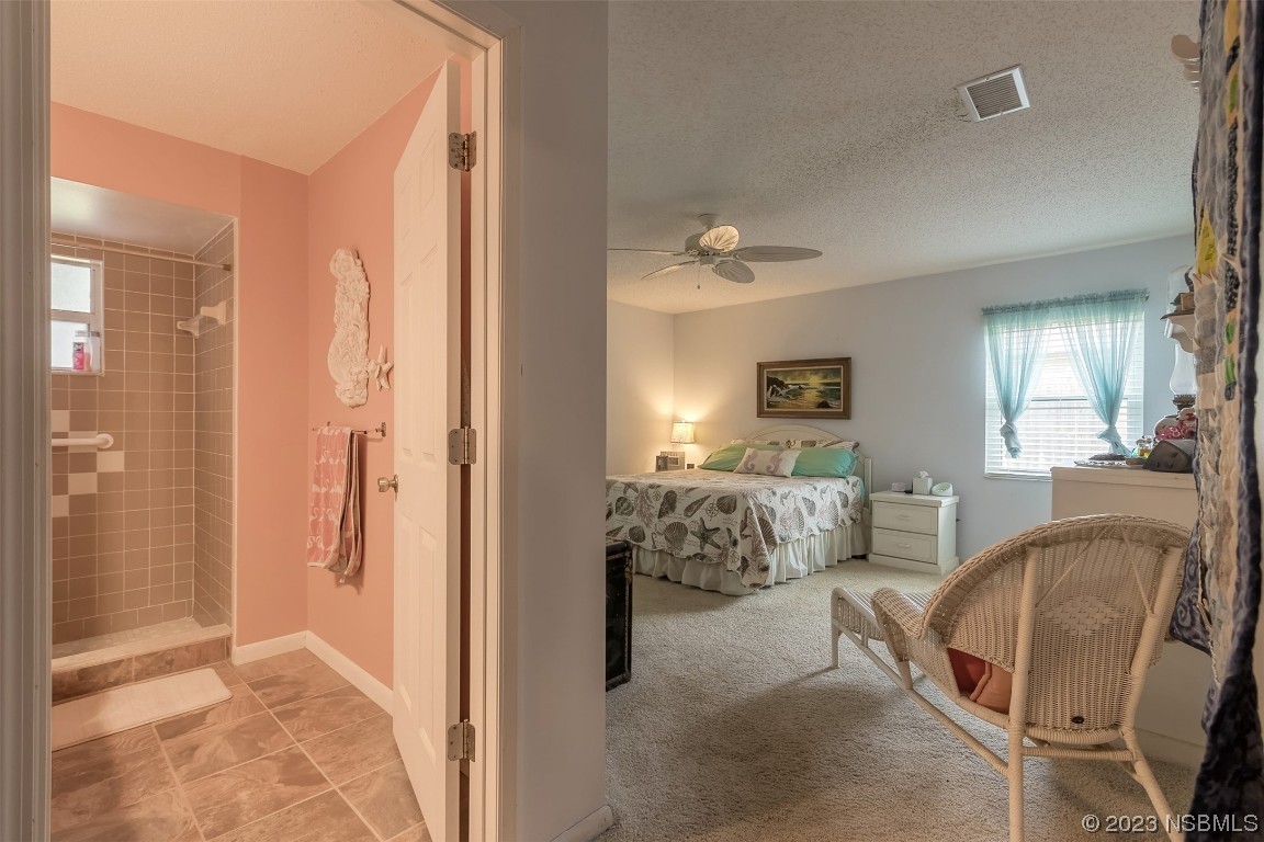 2828 Pine Tree Drive Edgewater, FL 32141 - Photo 15 of 38 a view of a livingroom with furniture and windows