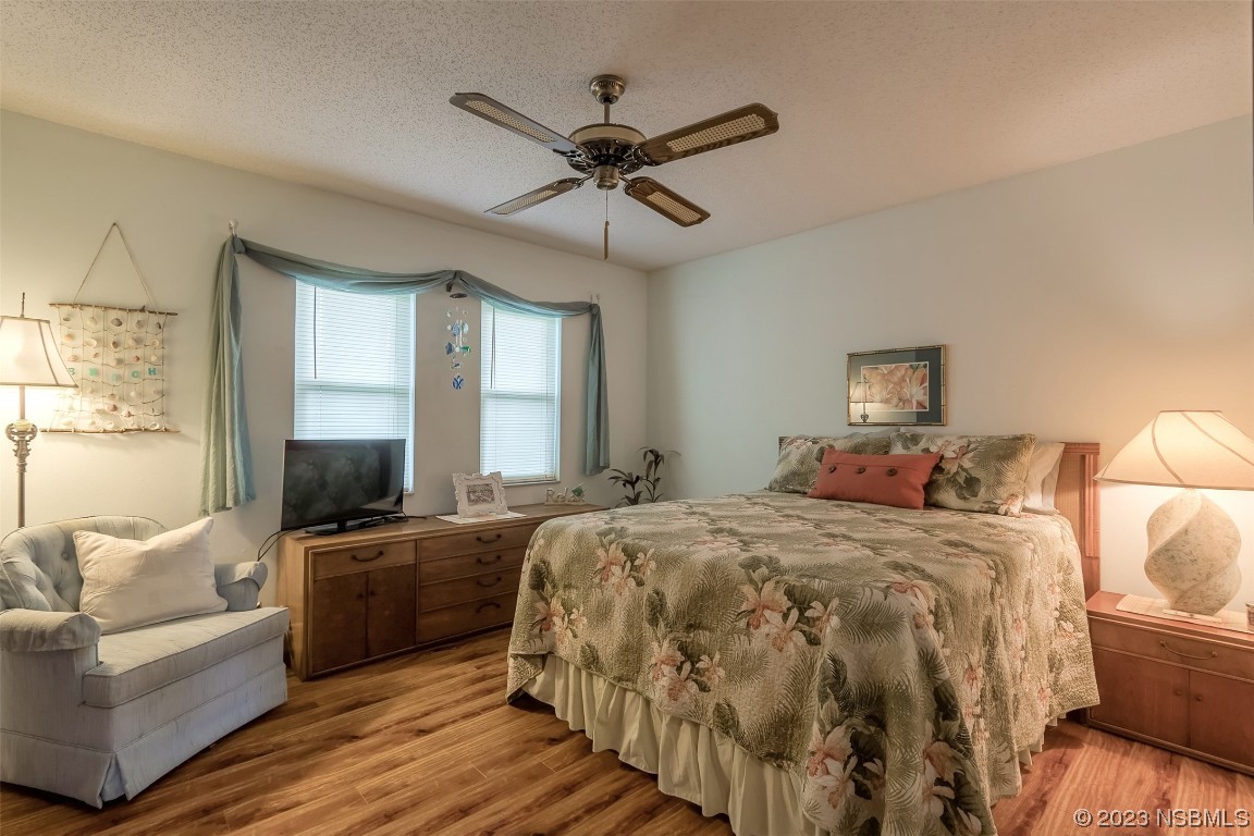 2828 Pine Tree Drive Edgewater, FL 32141 - Photo 19 of 38 a bed room with a bed and a couch