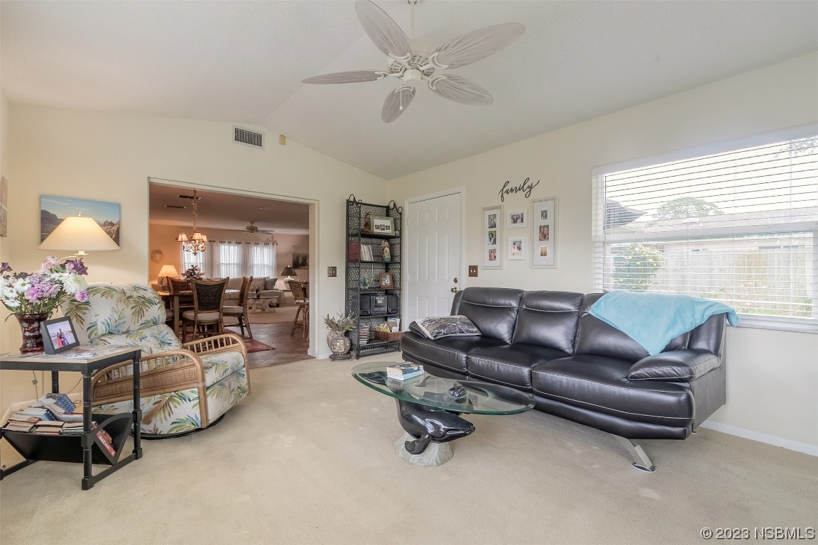 2828 Pine Tree Drive Edgewater, FL 32141 - Photo 24 of 38 a living room with furniture and a large window