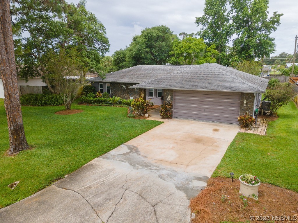 2828 Pine Tree Drive Edgewater, FL 32141 - Photo 31 of 38 a view of a house with a yard