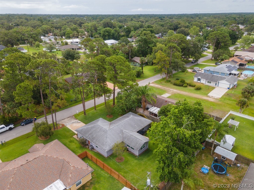 2828 Pine Tree Drive Edgewater, FL 32141 - Photo 34 of 38 an aerial view of a house with a yard