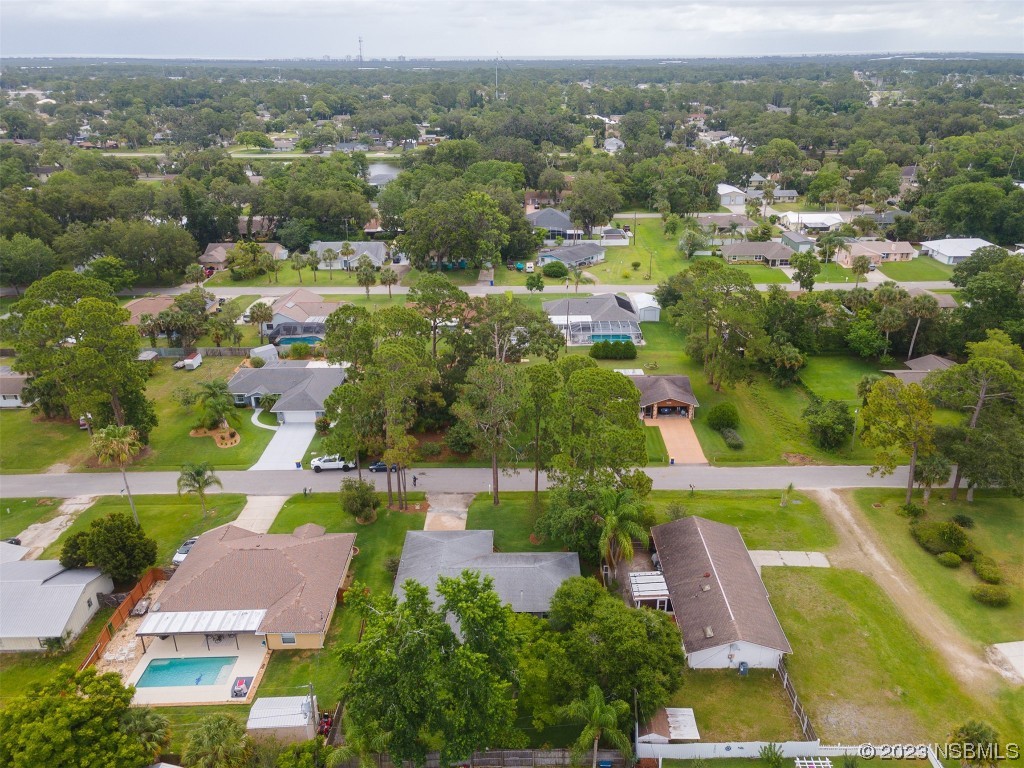 2828 Pine Tree Drive Edgewater, FL 32141 - Photo 35 of 38 an aerial view of residential houses with outdoor space and swimming pool