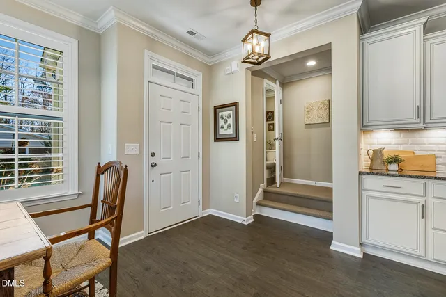 a view of a livingroom with wooden floor and a window