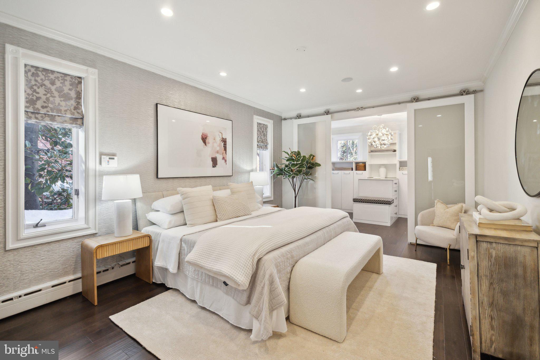 1527 31st Street Northwest Washington, DC 20007 - Photo 12 of 29 a spacious bedroom with a large bed and a window