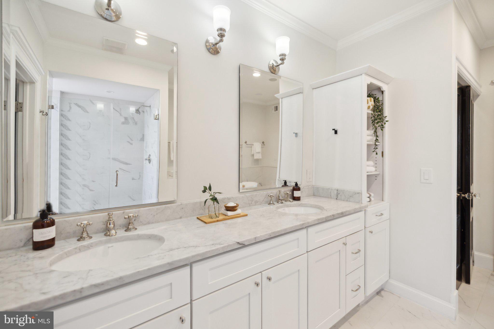 1527 31st Street Northwest Washington, DC 20007 - Photo 15 of 29 a bathroom with double sink and a mirror
