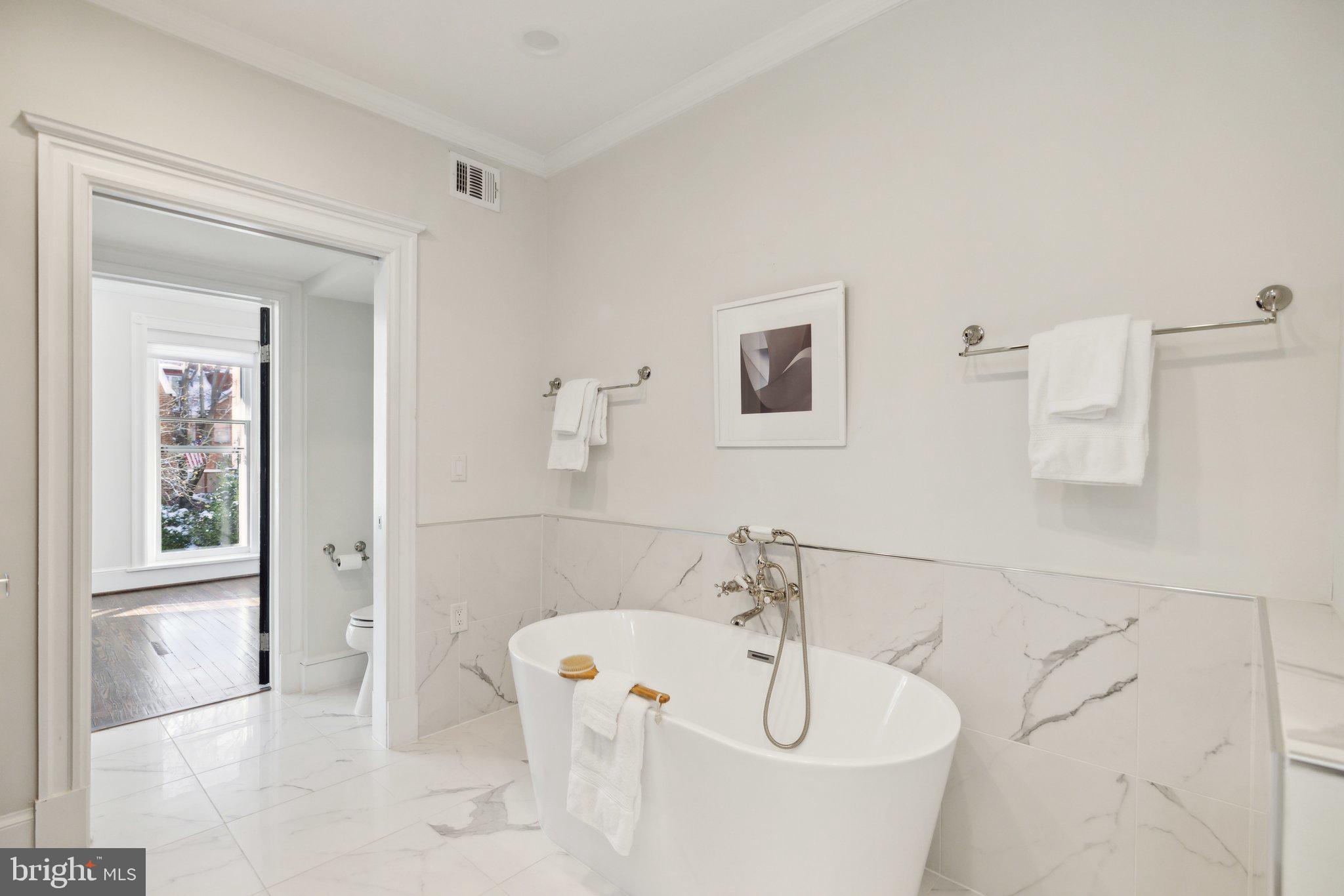 1527 31st Street Northwest Washington, DC 20007 - Photo 16 of 29 a bathroom with a bathtub and a sink