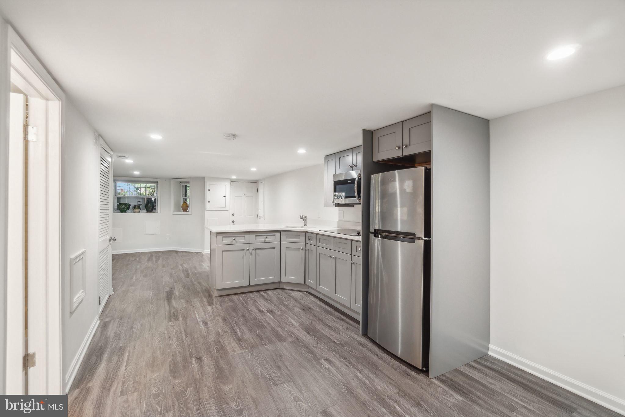 1527 31st Street Northwest Washington, DC 20007 - Photo 25 of 29 a kitchen with a refrigerator and a sink
