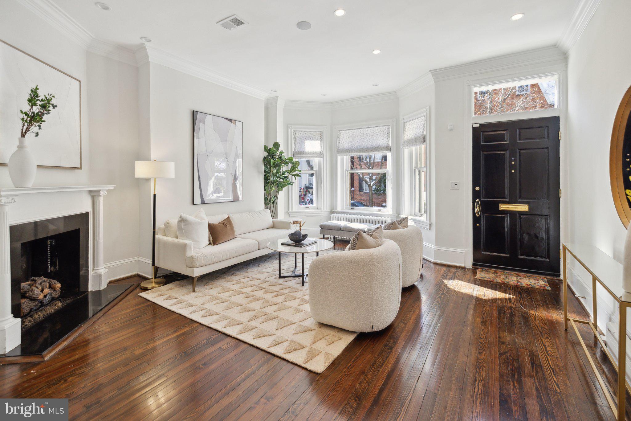 1527 31st Street Northwest Washington, DC 20007 - Photo 4 of 29 a living room with furniture and a fireplace