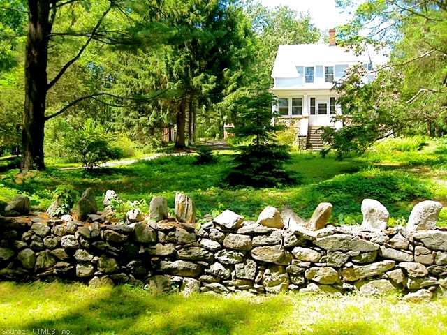44 Fox Road Woodbury, CT 06798 - Photo 1 of 1 a front view of a house with a yard and garden
