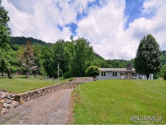 3964 Liner Creek Road Clyde, NC 28721 - Photo 13 of 17 a view of a big yard with a large trees