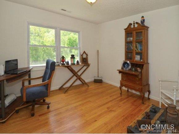 3964 Liner Creek Road Clyde, NC 28721 - Photo 5 of 17 a view of a workspace with furniture and a window