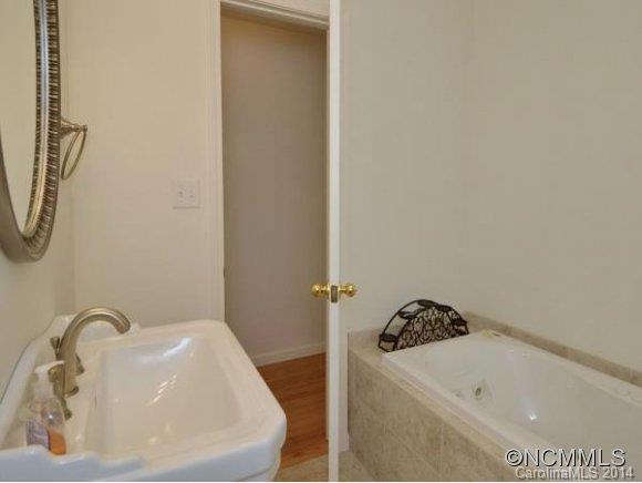 3964 Liner Creek Road Clyde, NC 28721 - Photo 6 of 17 a bathroom with a bathtub