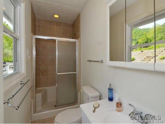 3964 Liner Creek Road Clyde, NC 28721 - Photo 9 of 17 a bathroom with a sink and a toilet