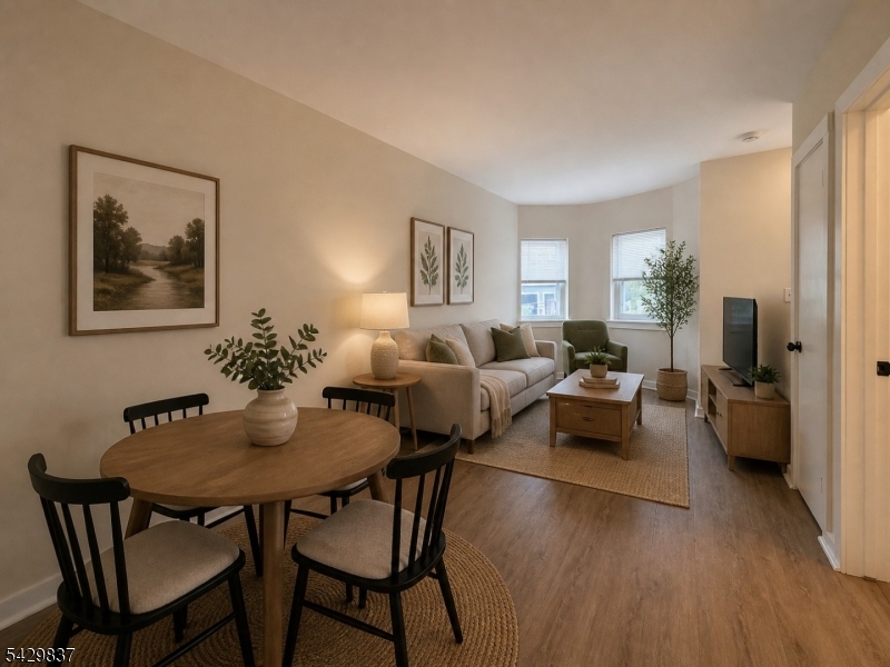 6 Southard Road, Unit 2 Mount Arlington, NJ 07856 - Photo 2 of 10 a living room with furniture and a wooden floor