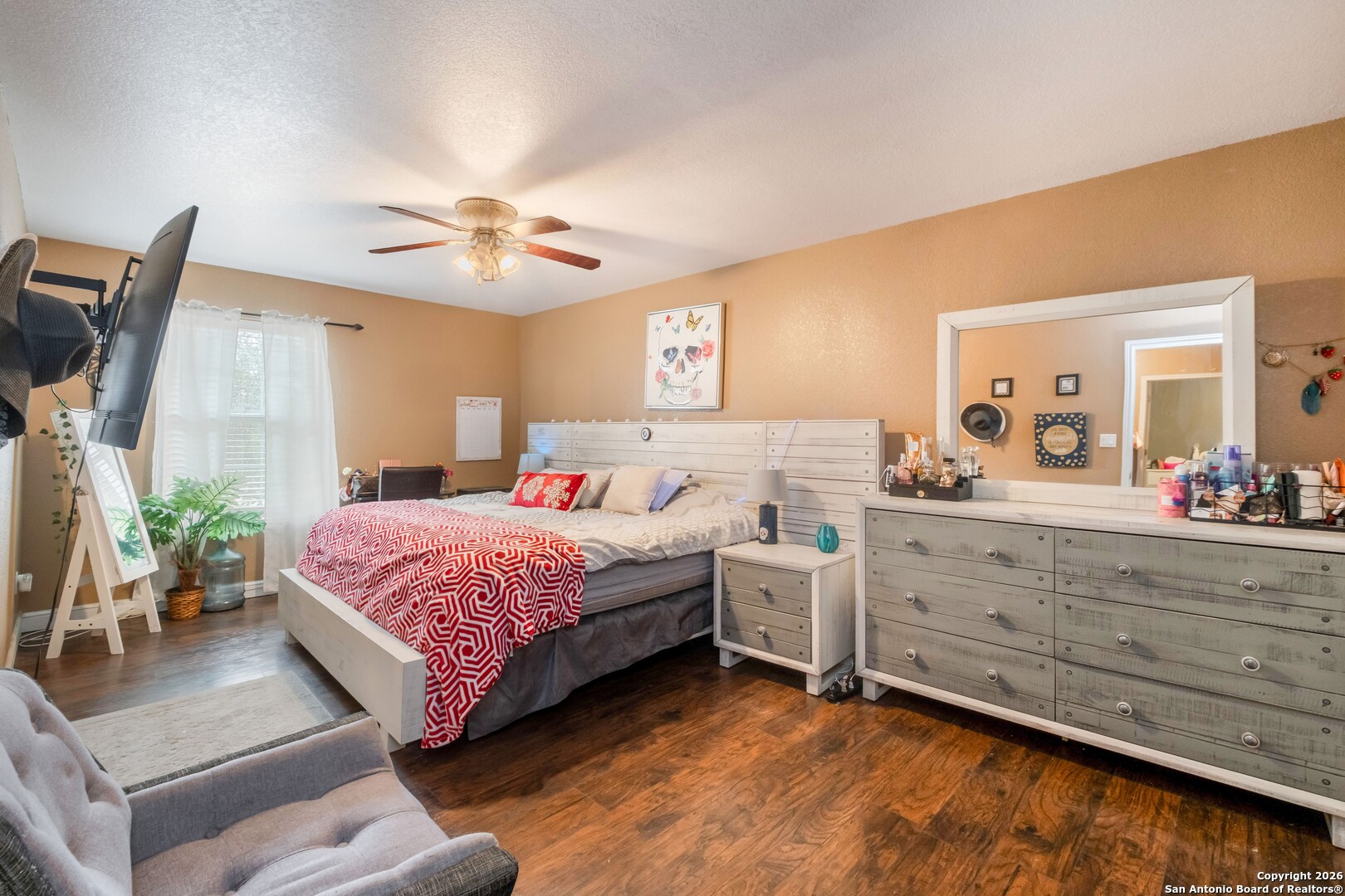 1655 Eichman Road Poteet, TX 78065 - Photo 20 of 45 a bedroom with a bed and a dresser