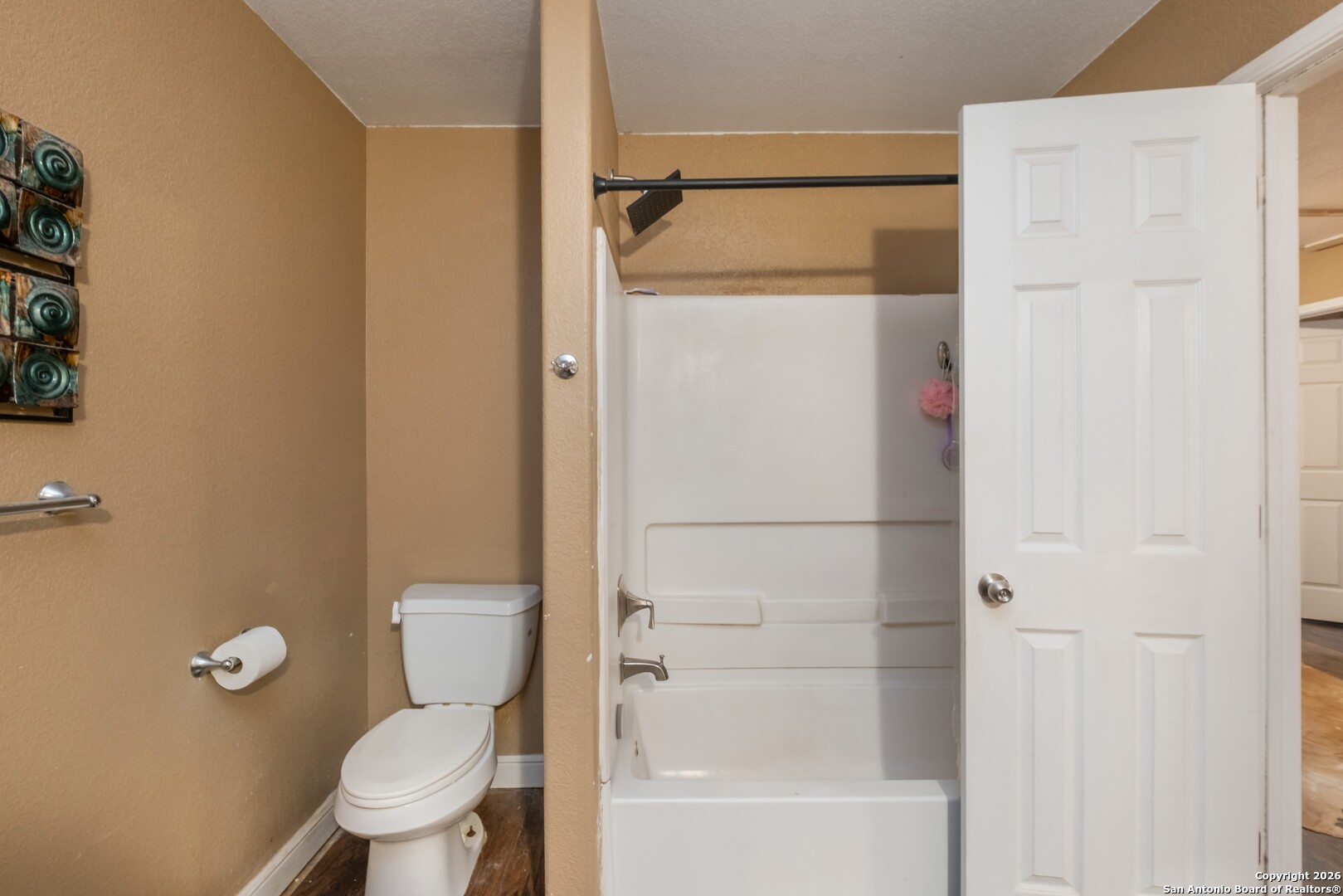 1655 Eichman Road Poteet, TX 78065 - Photo 23 of 45 a white toilet sitting next to a bathroom sink