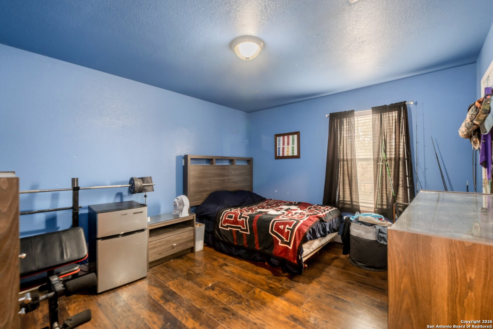 1655 Eichman Road Poteet, TX 78065 - Photo 26 of 45 a bedroom with a bed and a window