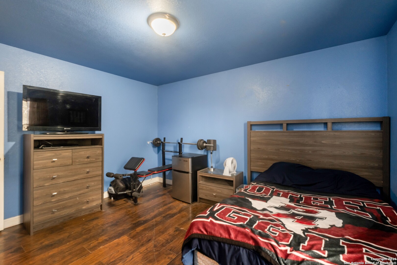 1655 Eichman Road Poteet, TX 78065 - Photo 27 of 45 a bedroom with furniture and a flat screen tv