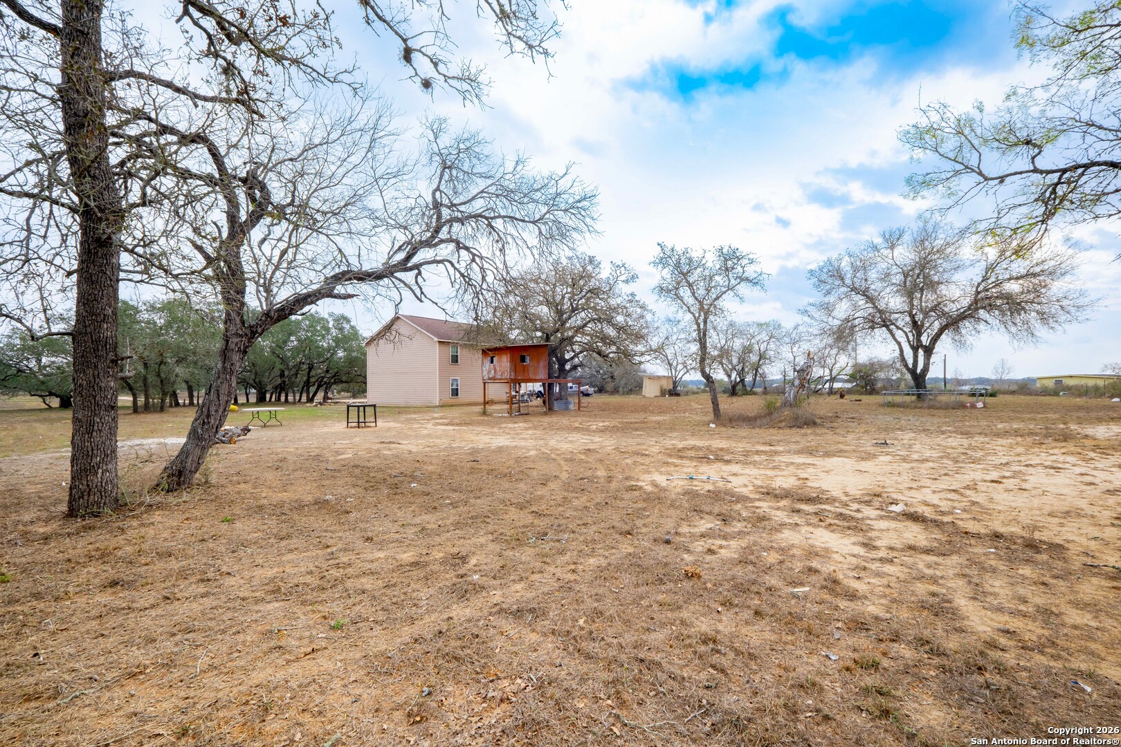 1655 Eichman Road Poteet, TX 78065 - Photo 32 of 45 a view of house with snow on the road