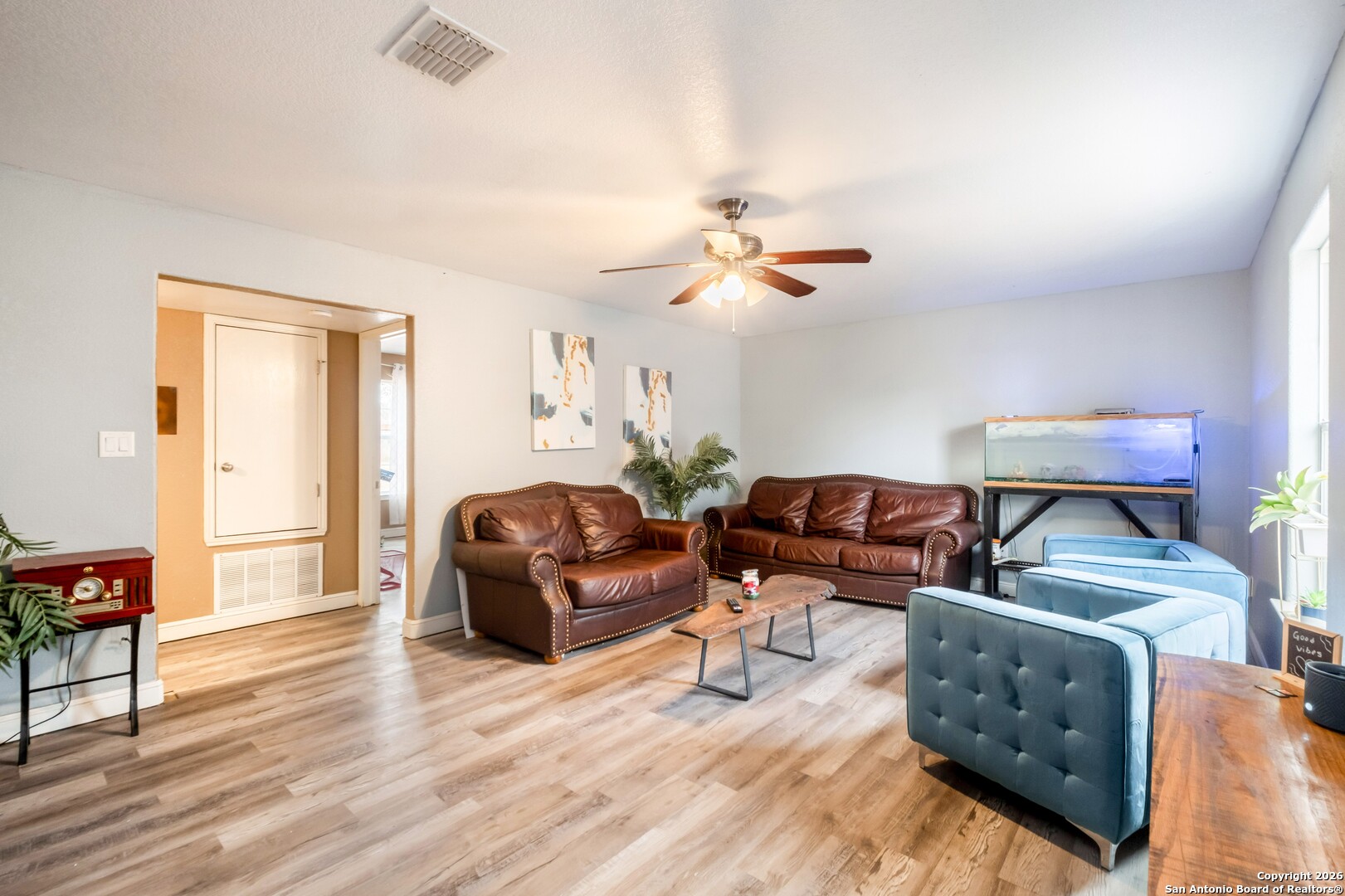 1655 Eichman Road Poteet, TX 78065 - Photo 6 of 45 a living room with furniture and a wooden floor